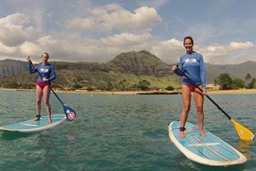 two girls paddle boarding